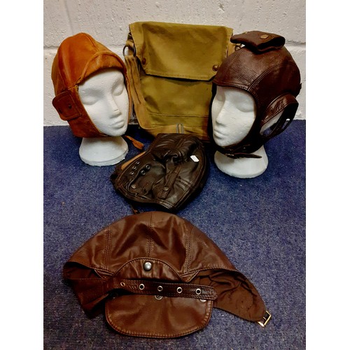 104 - Four vintage soft leather flying helmets to include
Cirrus examples and an army canvas bag. Location... 