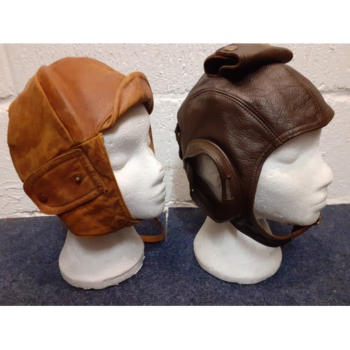 104 - Four vintage soft leather flying helmets to include
Cirrus examples and an army canvas bag. Location... 