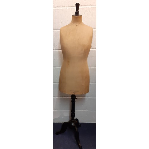 116 - An early 20th Century Selfridges adjustable dressmakers dummy, the upholstered torso having stencil ... 