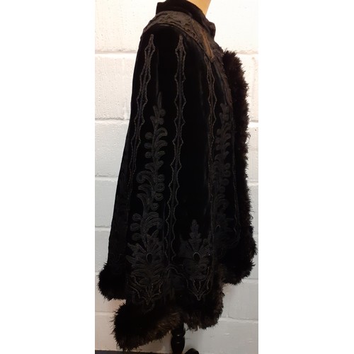 117 - A Victorian Jays Ltd of London black velvet mourning cape A/F having a black ostrich feather trim wi... 