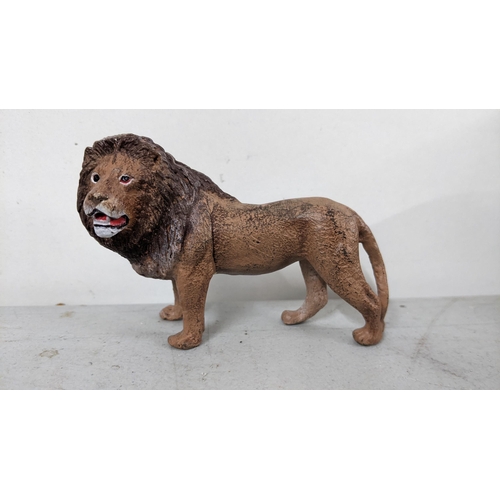 121 - A modern Bergmann style painted metal model of a lion
Location: 5.5