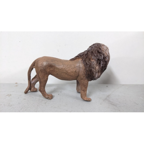 121 - A modern Bergmann style painted metal model of a lion
Location: 5.5