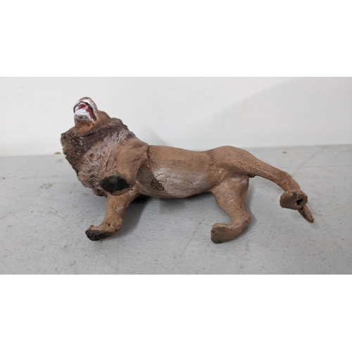 121 - A modern Bergmann style painted metal model of a lion
Location: 5.5