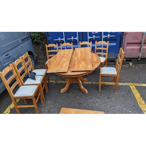 203 - A modern French style oak extending dining table on splayed leg, and eight ladder back chairs
Locati... 