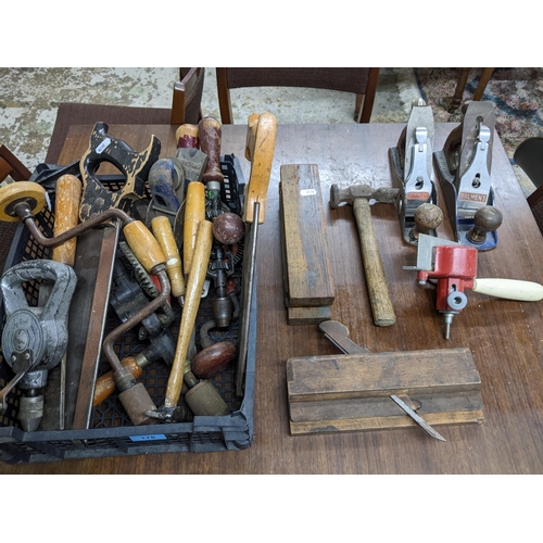 178 - A small box of woodworking tools to include a Salmon's and Stanley planes, drills, saws and other it... 