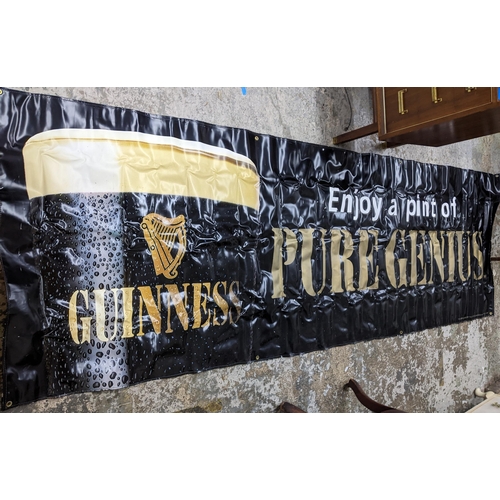 180 - A collection of Guinness memorabilia to include a banner 