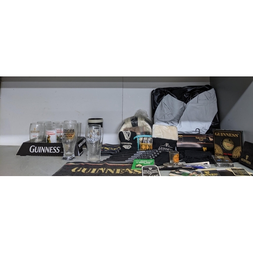 180 - A collection of Guinness memorabilia to include a banner 