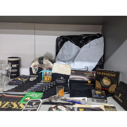 180 - A collection of Guinness memorabilia to include a banner 