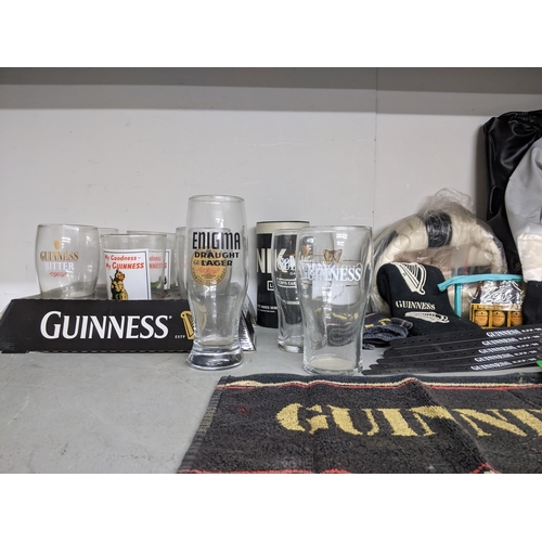 180 - A collection of Guinness memorabilia to include a banner 