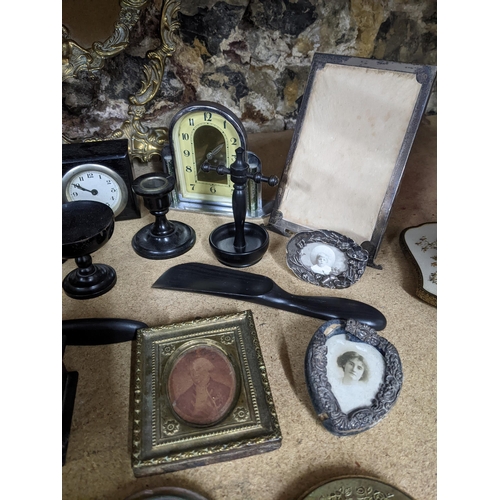 184 - A mixed lot to include two silver strict photograph frames and one other dressing table brush sets, ... 