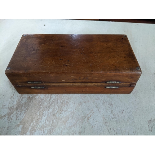 192 - A Victorian mahogany travelling chess set, the folding board with red and white plastic chess pieces... 