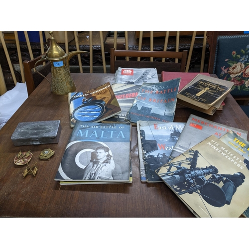 193 - A selection of items of military interest to include three WWII cap badges and a mess tin, a Saudi A... 