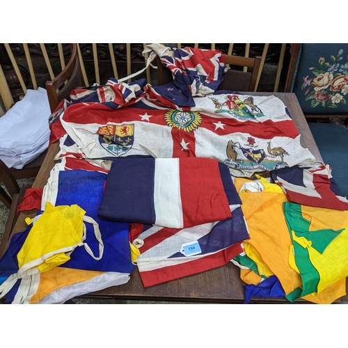 194 - A group of British Empire yachting flags, ensigns, and bunting to include a British Empire flag, cir... 