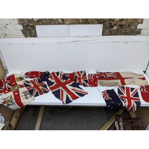 194 - A group of British Empire yachting flags, ensigns, and bunting to include a British Empire flag, cir... 