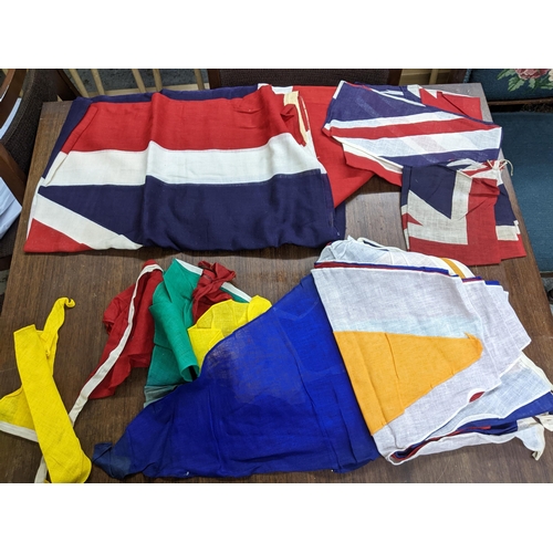 194 - A group of British Empire yachting flags, ensigns, and bunting to include a British Empire flag, cir... 