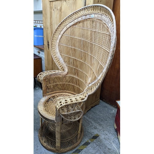 278 - A mid-century wickerwork peacock chair with a woven cane seat A/F with loose cushion Location:G