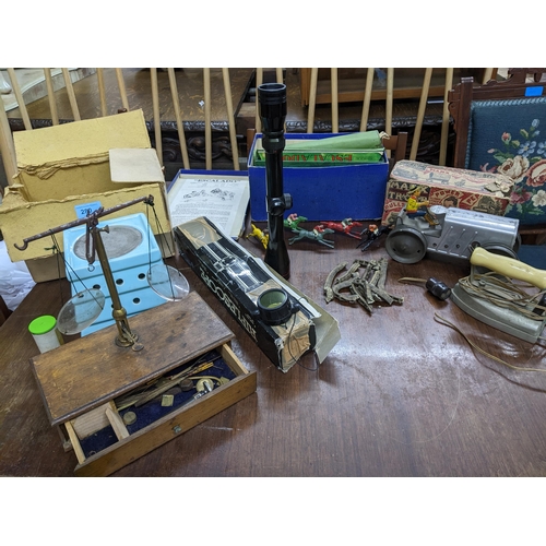 280 - A group of toys, and other items to include a vintage Escalado games, a Louis Marx Corp. tin plate c... 