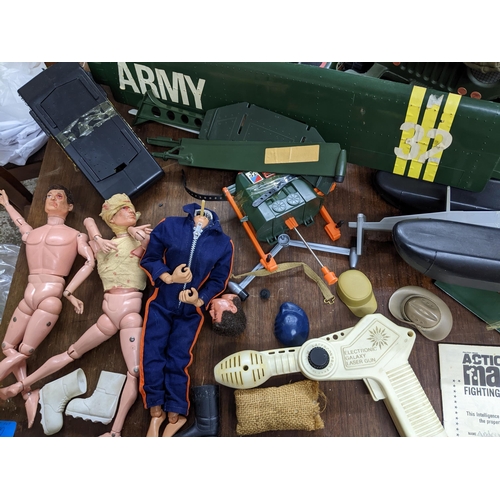 281 - A selection of Action Man fighting men and equipment to include a helicopter, and truck, along with ... 