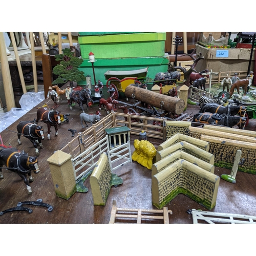 282 - A collection of Britain's hollow lead cast farm sets to include a model home farm series including f... 