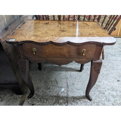 288 - A 19th century oak lowboy with a shaped top, over a drawer, on carved cabriole legs, 75cm x 84cm x 6... 