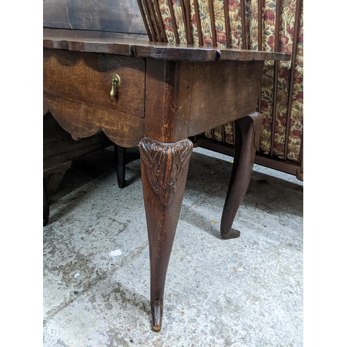 288 - A 19th century oak lowboy with a shaped top, over a drawer, on carved cabriole legs, 75cm x 84cm x 6... 