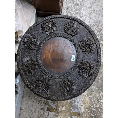 292 - An early 20th century carved hardwood table of a folding octagonal base
Location:G