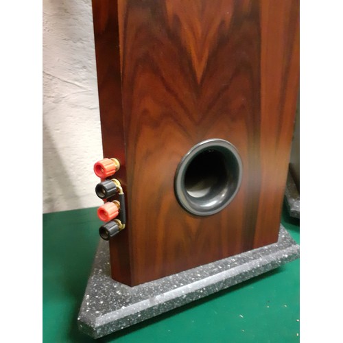 198 - A pair of MT speakers having a rosewood veneer case on a marble effect base above 3 metal feet, 33