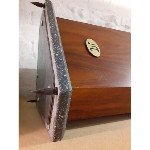 198 - A pair of MT speakers having a rosewood veneer case on a marble effect base above 3 metal feet, 33