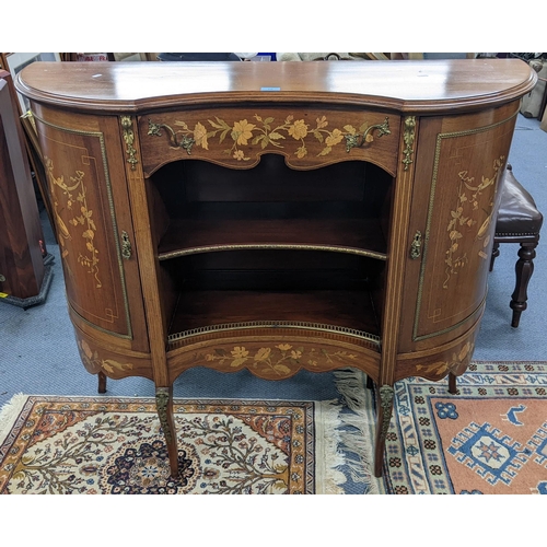 An Edwardian mahogany cabinet having marquetry inlaid and gilt metal mounts, central drawer above open shelves flanked by bow fronted drawers, 102cm h x 122cm w
Location:A1B