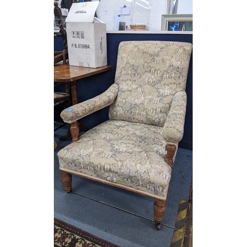 100 - A late Victorian John Reid & Sons deep oak armchair on turned front legs and signed casters
Location... 