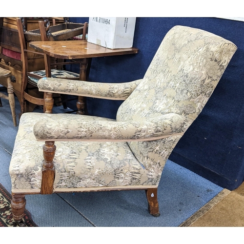 100 - A late Victorian John Reid & Sons deep oak armchair on turned front legs and signed casters
Location... 