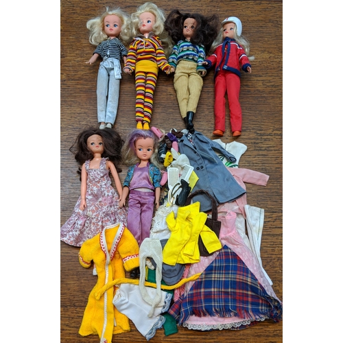 139 - Six 1980's Sindy dolls stamped 033055X to the rear of the neck wearing clothing and footwear togethe... 