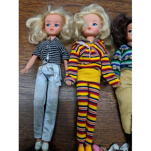 139 - Six 1980's Sindy dolls stamped 033055X to the rear of the neck wearing clothing and footwear togethe... 