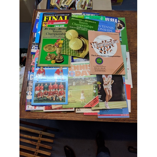 145 - Football, tennis and books relating to other sport and music. An assortment of football programmes f... 