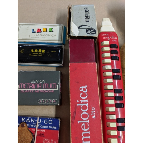 147 - Mixed musical instruments and various card games to include Top Trumps, Snip Snap a recorder, a Hohn... 