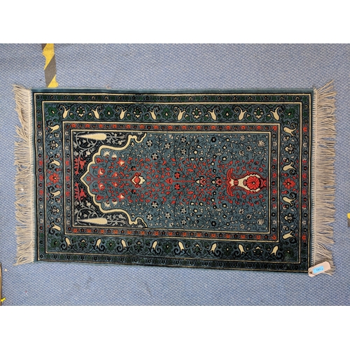 151 - A Turkish rug with multicoloured symmetrical decoration on a dark blue background 67cm 119cm
Locatio... 