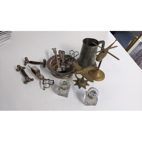 222 - A mixed lot to include candlesnuffer, wine coaster, brass model of a Spitfire, cutlery rests, pair o... 