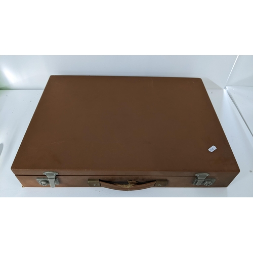 225 - A brown leather cased games set including roulette, chess etc
Location:LAB