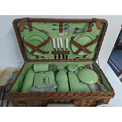 232 - A mixed lot to include a Coracle picnic set with wicker basket along with kitchen knives, stainless ... 