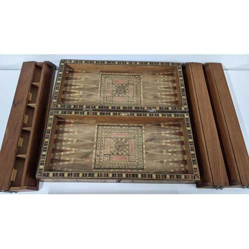 233 - An early 20th century Middle Eastern folding games board together with four game pieces boxes
Locati... 