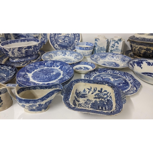 245 - A mixed lot of 19th century and later blue and white to include an Old Willow pattern soup tureen an... 