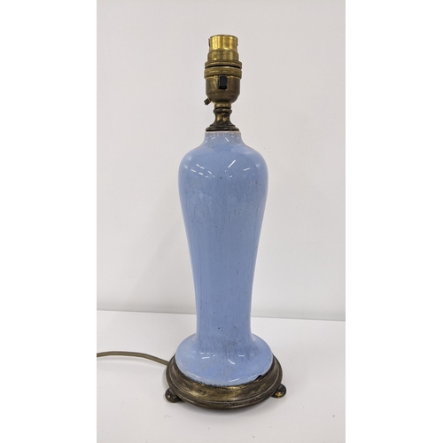 249 - An early 20th century blue mottled glazed table lamp mounted on a metal base
Location:R2.1