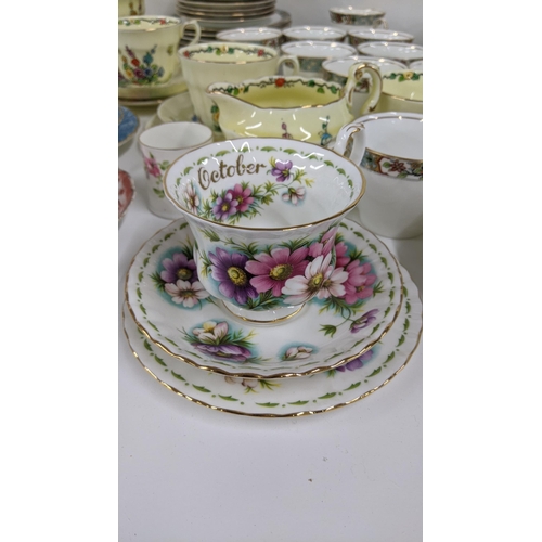 252 - A mixed lot of cups and saucers to include a Royal Albert flowers of the month series October togeth... 