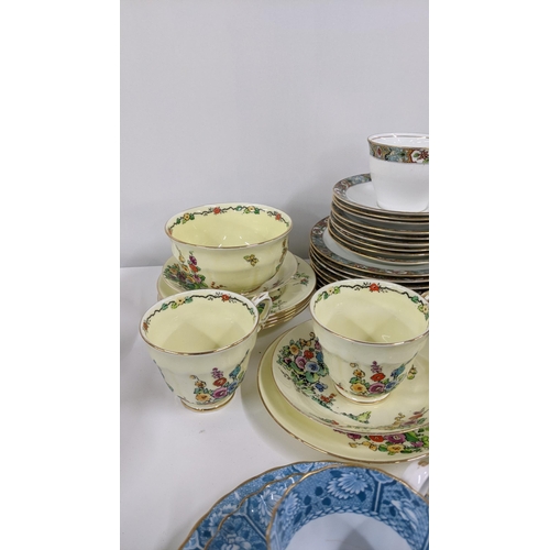 252 - A mixed lot of cups and saucers to include a Royal Albert flowers of the month series October togeth... 