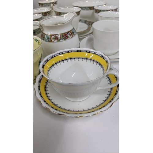 252 - A mixed lot of cups and saucers to include a Royal Albert flowers of the month series October togeth... 