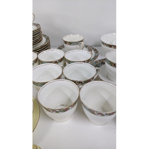 252 - A mixed lot of cups and saucers to include a Royal Albert flowers of the month series October togeth... 