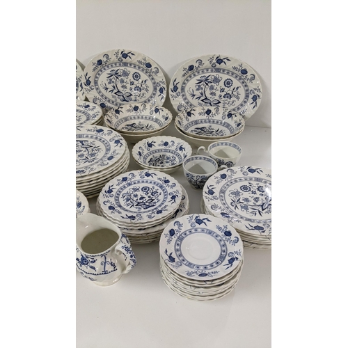 254 - A large collection of blue and white teal dinner services, to include Johnson brothers service and o... 