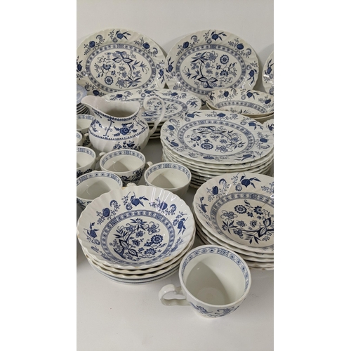 254 - A large collection of blue and white teal dinner services, to include Johnson brothers service and o... 