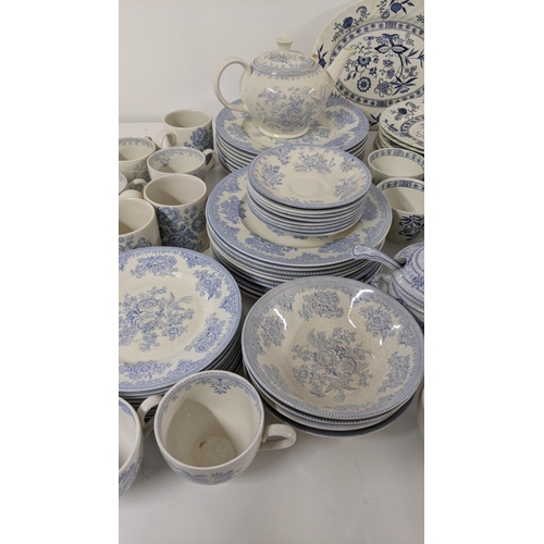 254 - A large collection of blue and white teal dinner services, to include Johnson brothers service and o... 