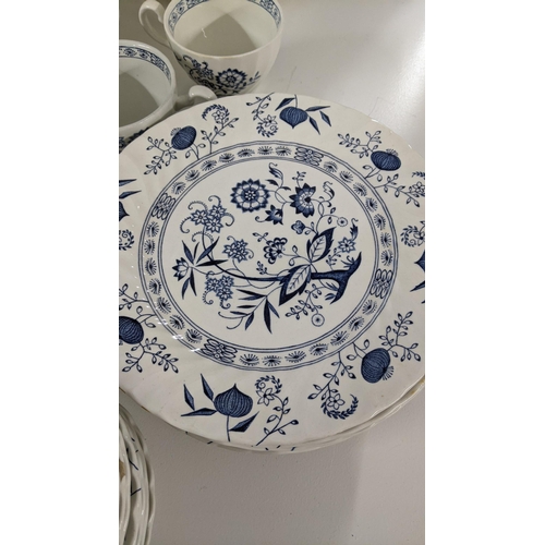 254 - A large collection of blue and white teal dinner services, to include Johnson brothers service and o... 